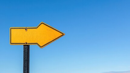 Sunlit Pointer: A Vibrant Yellow Arrow Against an Azure Sky for Wayfinding Visuals
