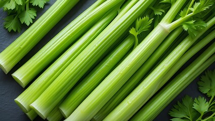 Fototapeta premium Closeup view of vibrant green celery stalks arranged on a dark surface accompanied by fresh parsley sprigs showcasing the crisp texture and juicy appearance of the vegetable ideal for culinary