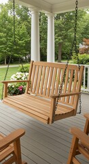 Inviting porch swing with chains and white columns, surrounded by lush greenery