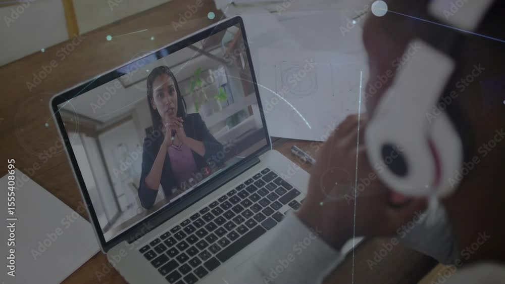 Poster woman gesturing on laptop initiating network visuals while man leans in tech call showing data flow