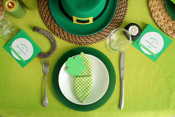 Festive table serving with leprechaun's hat, top view. St. Patrick's Day celebration