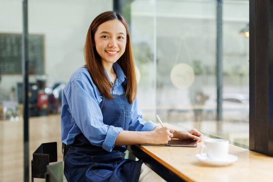 Asian woman, tablet and small business in ecommerce, fashion or logistics in remote startup at work. asian female owner working on touchscreen technology in clothing store success
- Powered by Adobe