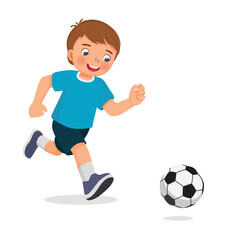 Little boy playing football soccer running toward the ball