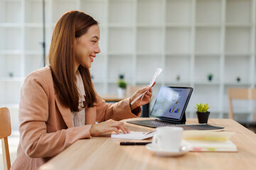 Young woman holding bills working for calculate business data, taxes, bills payment, Start up...