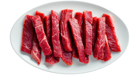 Fresh raw beef strips on a white plate, ideal for cooking or meal preparation.