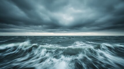 Obraz premium Dark Stormy Sea Under Gloomy Clouds Captured in Dramatic Mood and Natural Elements of Water and Sky