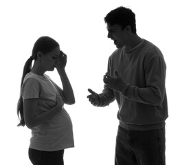 Silhouette of angry man shouting at his pregnant wife on white background. Domestic violence concept