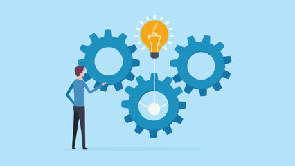 Man interacting with gears and a glowing lightbulb symbolizing innovation and teamwork