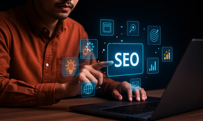 Man Interacting with SEO Hologram Interface on Laptop &ndash; Digital Marketing and Search Engine Optimization Technology Concept