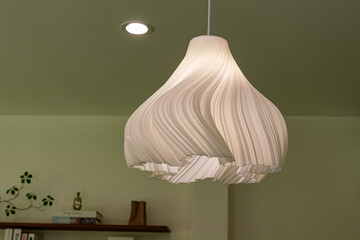 A modern glass pedant lamp in the living room in a house.