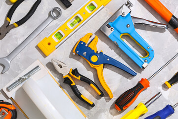 Arrangement of construction tools on white grunge background