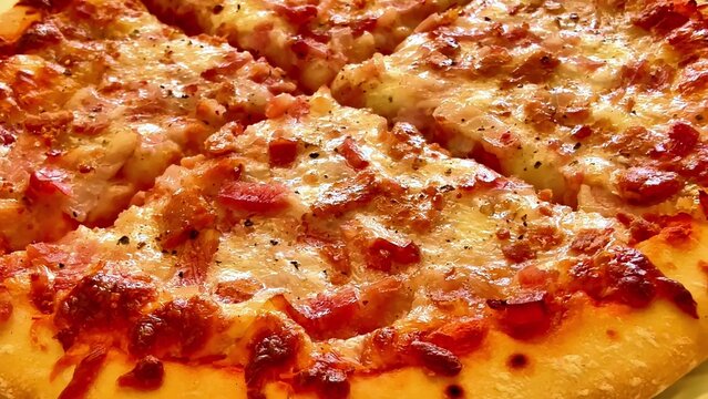 A mouthwatering cheese and crispy bacon pizza elegantly served on a rustic plate, ideal for any special occasion - Powered by Adobe