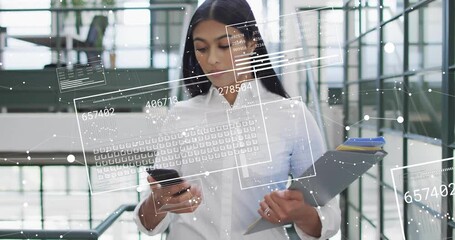 businesswoman descending staircase and scanning holographic business data by tapping smartphone - Powered by Adobe