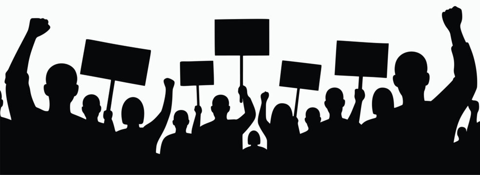 Silhouette of protesting crowd with raised fists and blank signs in a political demonstration