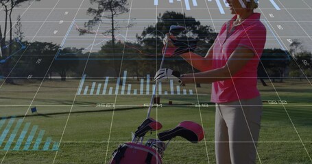 Adult woman entering tee box and lifting club while golf tech overlays analyzing swing metrics - Powered by Adobe
