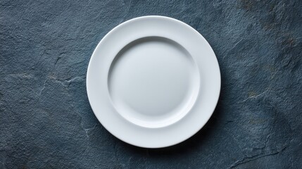 Elegant White Plate on a Textured Dark Surface, Ideal for Food Presentation and Culinary Photography, Showcasing Simplicity and Style for Kitchen Decor