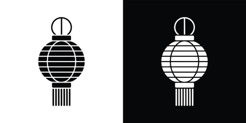 Fototapeta premium Black and White Silhouette of a Striped Round Lantern with Tassel Decoration
