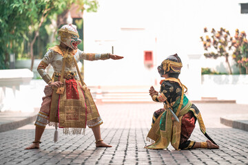 Obraz premium Elegance in motion thai traditional dance of the ramayana khon thailand cultural performance outdoor stage artistic expression