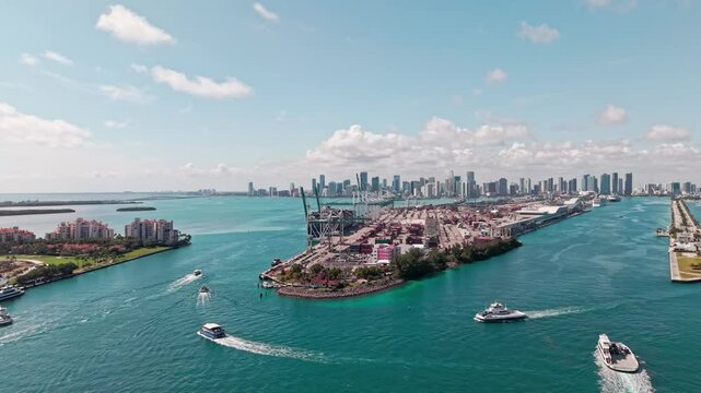 Cityscape with Miami port and boats in sea, aerial view. Aerial view. Miami port. Cargo port with container. Port of Miami. Dodge island and cityscape. Cargo business