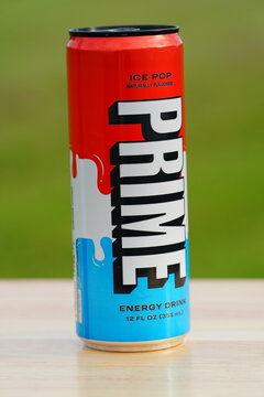 A Red, White, and Blue Can of Prime Sugar-Free Ice Pop Energy Drink 12 fl oz with 200mg Caffeine.