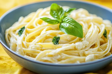 Creamy fettuccine pasta with fresh basil.