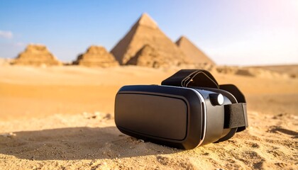 VR headset on sand in front of Giza pyramids with travel and virtual experience.