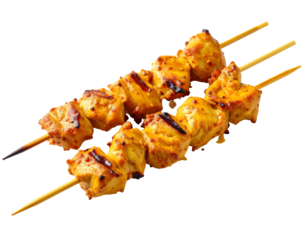 Delicious chicken skewers on a dark background