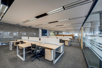 Modern office room area with chairs and tables