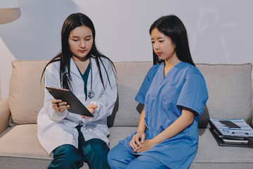 A doctor uses a stethoscope to check the heartbeat of his patient. Patients must undergo a yearly...