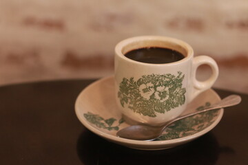A cup of hot black coffee