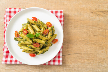 penne pasta with pesto sauce and tomatoes