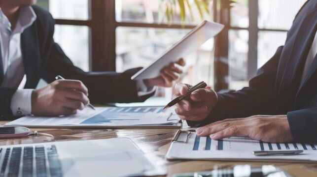 Real estate agent presenting a property valuation report to clients.