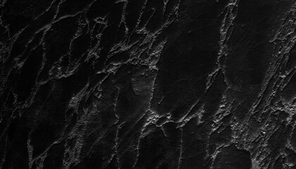 Dark cracked black grunge texture background with dramatic lighting effect
