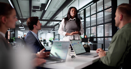 Team Collaboration At Company Meeting: Diverse Staff Training