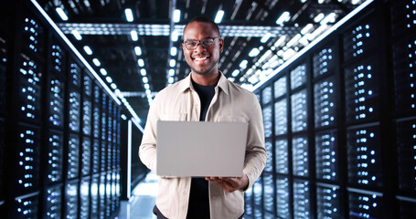 Smiling IT Technician Setting Up Artificial Intelligence System