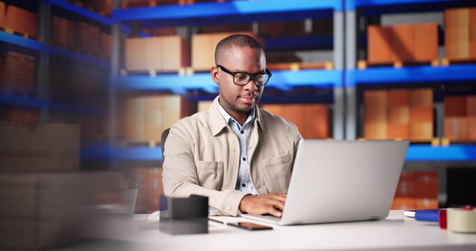 Tech-Savvy Warehouse Manager Processing Online Orders