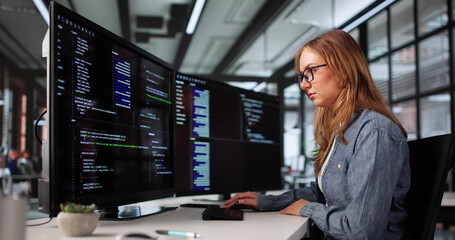 Young Woman Coding On Office Computer