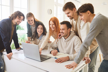 Young people discussing job project or new startup with brainstorming standing on workplace in...