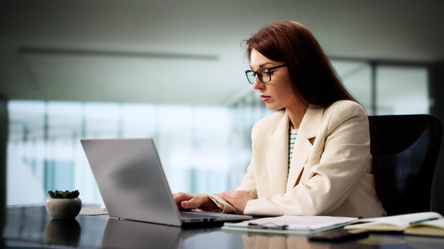 Female CEO Boosts Productivity With Laptop