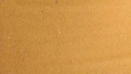 Background of brown kraft paper or cardboard texture. Abstract pattern of beige rough carton, old paper sheet.