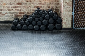 Fototapeta na wymiar Dumbbells on floor in gym