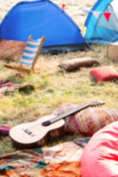 Tents by guitars and chairs