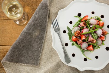 Fresh food with wine served on wooden table