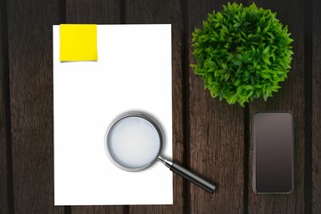 Magnifying glass on paper on the side of smartphone
