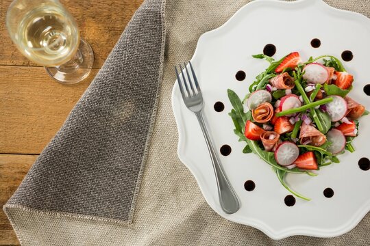 Naklejki Fresh food with wine served on wooden table