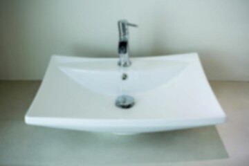 Water running from faucet in wash basin