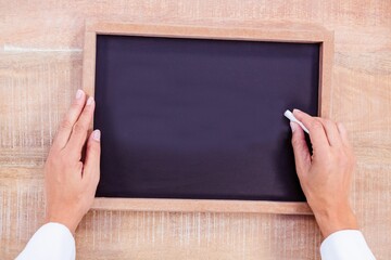 Hand writing on chalkboard © vectorfusionart