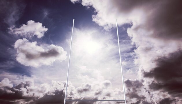 Fototapeta Rugby goalposts are standing under partly cloudy sky, with bright sunlight breaking through