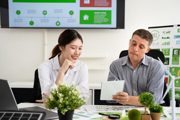 Corporate officer workers collaborate in office Sustainable Development meeting , ESG and Business...