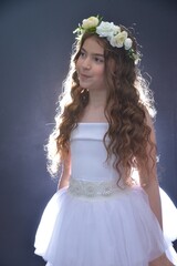 High resolution close up studio portrait of a single beautiful 12 year old Caucasian girl in a...